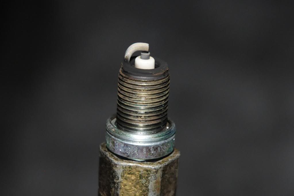 1 spark plug black, others white. SaabCentral Forums